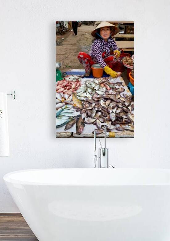 Fish seller in Phu Quoc market shows fresh catch for sale by Marco Brivio