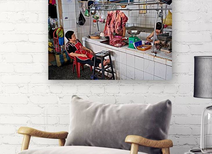 Market scene in Ho Chi Minh City with meat vendor and customer by Marco Brivio