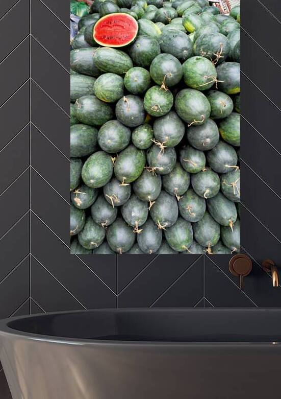 Watermelons stacked at a market in Phu Quoc Vietnam by Marco Brivio