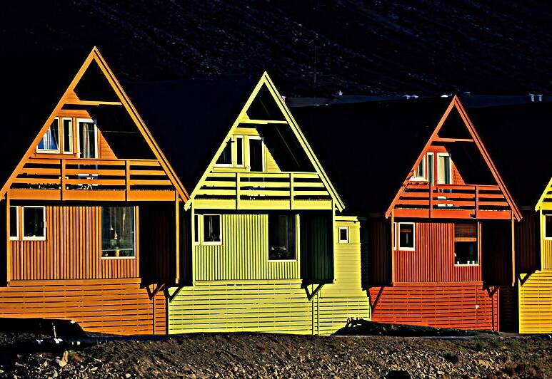 Colorful houses in Longyearbyen Svalbard under sunlight by Marco Brivio