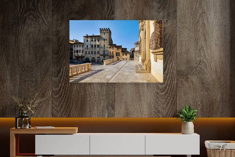 People walk through Piazza Grande in Arezzo Italy by Marco Brivio
