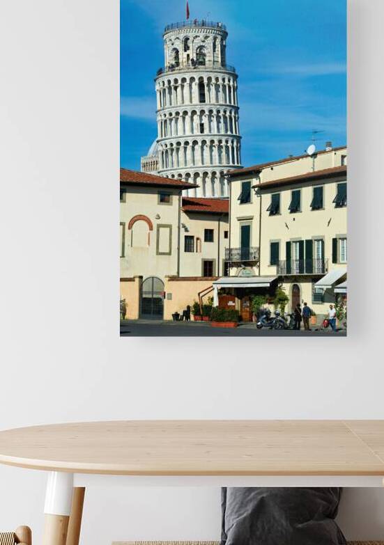Leaning Tower of Pisa stands tall against a blue sky by Marco Brivio