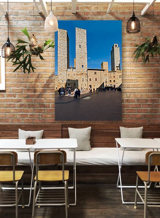 Tourists explore the towers in Piazza del Duomo in San Gimignano by Marco Brivio