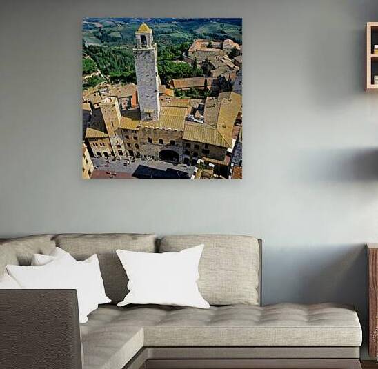 View of San Gimignano in Tuscany from above during the day by Marco Brivio