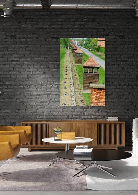 Watchtowers and fence at Auschwitz camp in Poland by Marco Brivio