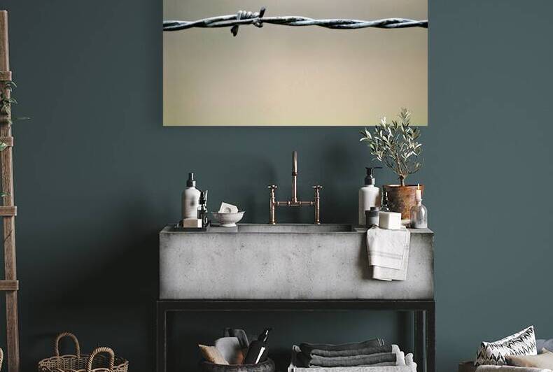 Barbed wire at Auschwitz concentration camp in Krakow Poland by Marco Brivio