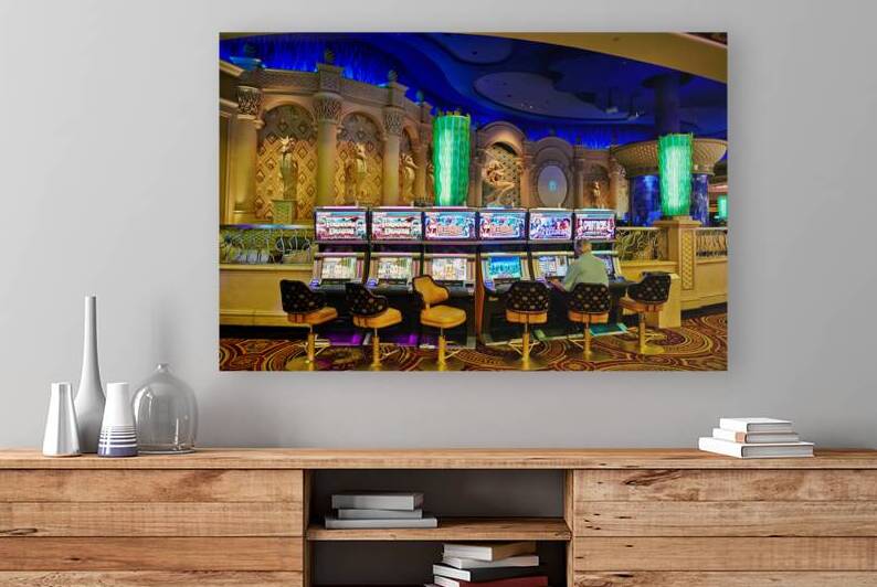 Gaming at slot machines in Caesars Palace Casino in Las Vegas by Marco Brivio