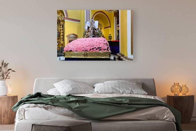 Visitors admire the statue in Iglesia de Santa Isabel by Marco Brivio