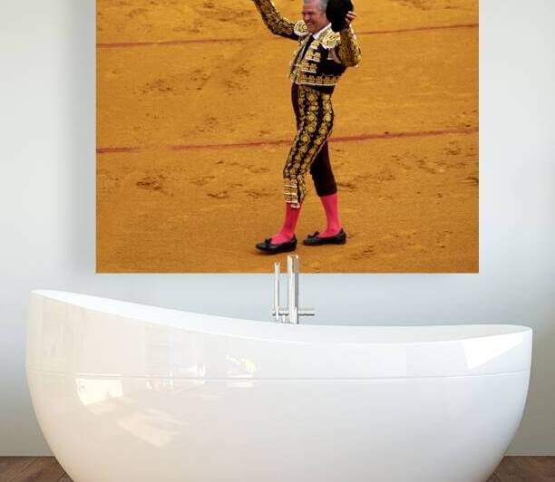 Bullfighter performs in Seville Arena during bullfight event by Marco Brivio