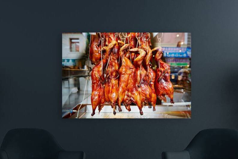 Hanging roast ducks in SFs Chinatown market by Marco Brivio