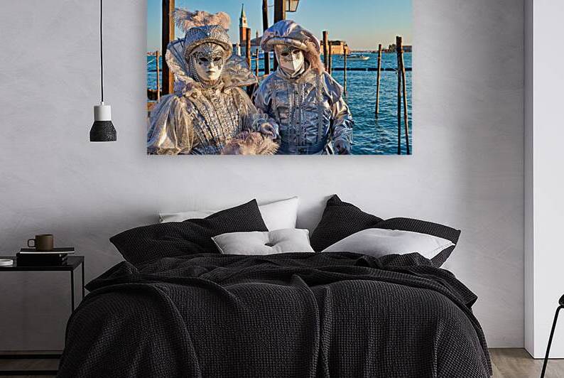 Venice Carnival with silver costumes near water by Marco Brivio